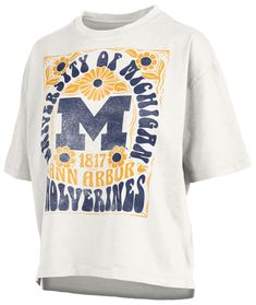 a white t - shirt with the words m and an image of flowers on it