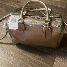 New With Tags Elegant Coach Satchel With Zipper Closure, Coach Gold Crossbody Satchel, Gold Coach Crossbody Satchel, Elegant Satchel With Branded Hardware For On-the-go, Elegant On-the-go Satchel With Branded Hardware, Formal Gold Coach Satchel, Blue Coach, Coach Satchel, Coach Crossbody Purse