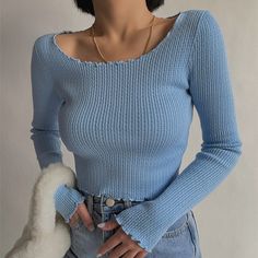 Winter Light Blue Ribbed Top, Winter Blue Ribbed Tops, Trendy Blue Long Sleeve Tops, Blue Long Sleeve Ribbed Top, Winter Ribbed Blue Tops, Light Blue Long Sleeve Winter Top, Light Blue Long Sleeve Top For Winter, Fitted Light Blue Winter Tops, Winter Blue Solid Color Tops