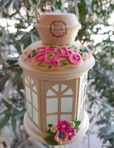 a cake shaped like a lantern hanging from a tree