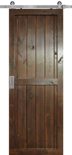 an open wooden door with metal bars on the bottom and side panels, in front of a white background