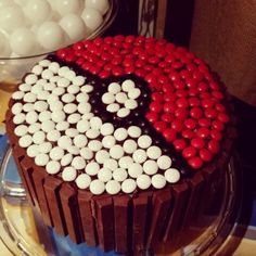 a chocolate cake decorated with white and red candies