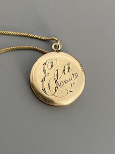 "Weight: 11.9g Dimensions: 1\" round, 18\" chain Hallmarks: Makers mark L & M Although these lockets were patented in the year 1902, this particular locket states on its backside that it is from the 'class of '12' dating it to a decade later. This is a very unique locket in that it has 3 windows and folds like an accordion. All bezels are present and the two clear windows inside the front and back covers are still present. The locket measures 1\" round and comes on an 18\" GF chain. Very lig Vintage 14k Gold Locket Necklace, Vintage 14k Gold Locket Necklace Stamped 14k, Victorian Round Locket Necklace Stamped 14k, Antique Medallion Locket Necklace Stamped 14k, Antique Stamped Pendant Necklaces, Victorian Jewelry With Coin Pendant, Victorian Necklace With Coin Pendant For Formal Occasions, Classic 14k Stamped Medallion Locket Necklace, Heirloom Yellow Gold Necklace With Hallmarks