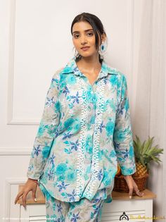 ▪ Kurti Fabric: Cotton ▪ Sleeves: Full Sleeves ▪ Kurti Length: 30-31 Inches ▪ Pant Length: 35-36 Inches ▪ Occasions: Casual Wear, Office Wear, Festive Wear ▪ Garment Care: Hand Wash Only ▪ Price Includes: 1x Kurti with Pant ▪ BLUE NADIRA COTTON CHIKANKARI CO-ORD SET TheChikanLabel designer studio presents Blue Nadira Cotton Chikankari Co-ord Set. Floral motifs with 'intricate embroidery' are delicately placed on this handmade Chikankari Set, this perky hand embroidered Lucknowi Chikan Kurti Pant Set is a reminiscent of blooming springs and the serenity that surrounds it. Your skin will surely fall in love with soft fabric that will keep you comfortable all day long and make yourself happier this season by choosing it for festivals and parties. ▪ HAND-MADE, NOT MACHINE -MADE "Crafting Cultu Blue Floor-length Sets With Chikankari Embroidery, Summer Blue Embroidered Top With Chikankari, Blue Chikankari Embroidery Maxi Set, Blue Maxi Length Set With Chikankari Embroidery, Summer Blue Chikankari Embroidered Top, Ethical Clothing Brands, Women's Outfit Sets, White Kurta, Kurtis With Pants