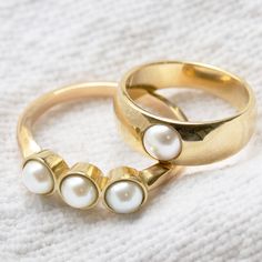 Maya Brenner x Sarah Hendler is an effortless pearl collection with pieces that feel modern, chic and not too fancy. Our Tres Pearl Ring is solid 14K yellow gold with a 2mm band and three 4mm bezel set white pearls. Please allow 2-3 weeks for processing Classic Gold Stackable Pearl Rings, Modern 14k Gold Pearl Ring For Wedding, Gold Pearl Stackable Rings For Anniversary, Minimalist Akoya Pearl Gold Ring, Minimalist Gold Akoya Pearl Ring, Emerald Rings, Pearl Collection, Gold Piece, Timeless Jewelry