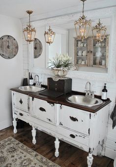 a bathroom with two sinks and mirrors on the wall next to a rug in front of it