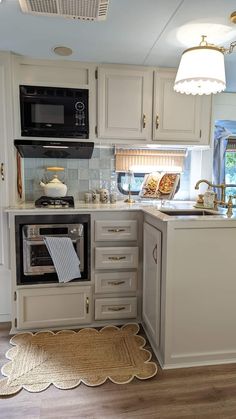 a kitchen with an oven, sink and dishwasher