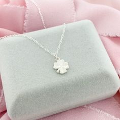 A simple and elegant sterling-silver Four Leaf Clover, a perfect lucky charm to wear during the day. The Clover Pendant is dainty, very lightweight and would be perfect for layering or as a stand-alone necklace. * D E T A I L S * * 10mm charm * Sterling Silver * Dainty Style * 3 chain lengths available (16, 18, and 20 inch) L I K E ∙ W H A T ∙ Y O U ∙ S E E ? More Clover Jewelry * https://etsy.me/2v16Q1K More Necklaces * https://etsy.me/2PEnETk More from our shop * https://etsy.me/2vasKjo Are yo Lucky Four Leaf Clover, Silver Initial Charms, Lucky Charm Necklace, Clover Jewelry, Dainty Style, Pretty Jewelry Necklaces, Celtic Pendant, Signature Necklace, Four Leaf Clover Necklace