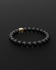 Experience simplicity at its finest with the Essential Bracelet. This piece embodies the elegance of minimalism, crafted for those who find beauty in understatement. It's a subtle yet powerful expression of self, perfect for visionaries who appreciate the grace in simplicity and make their mark with a quiet yet impactful presence. All our stones are chosen by hand to satisfy AAA quality standards. They are natural stones and their size and color can vary slightly. Stone: AAA Grade 8mm Metal: 925 Elegant Onyx Beaded Round Bracelets, Elegant Onyx Stretch Bracelet, Luxury Onyx Bracelets, Hand-strung Adjustable Onyx Stretch Bracelet, Mens Onyx Bracelet, Stacked Necklaces, Red Tigers Eye, Onyx Necklace, Onyx Bracelet