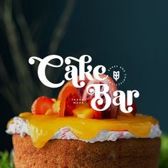 a cake with fruit on top and the words cake bar in white lettering above it