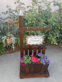 a wooden planter with flowers in it