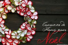 a red and white wreath on a wooden wall with the words, courron de fleurs pour noel