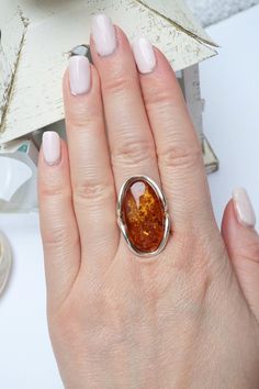 Natural Amber Ring, Baltic Amber Ring, Large Amber Ring, Cognac Amber Ring, Golden Amber Ring, Amber Ring, Amber Ring, Amber Jewellery, Amber , Cognac Amber Ring, Amber And Silver Ring, Amber Jewelry, Amber And Sterling Silver, Handmade Amber Ring, Handmade Jewellery, Adjustable Ring, Coctail Amber RIng, Adjustable Amber Ring, Amber Gift, Gift For Wife This is a beautiful 925 sterling silver, unique, handmade, high quality natural baltic amber ring. Ring height is 3 cm - 1,18 inches x 1,9 cm - 0 Amber Open Ring For Anniversary, Handmade Oval Amber Rings, Unique Amber Wedding Rings, Unique Amber Open Ring, Shifting Closet, Amber Price, Golden Amber, Black Beaded Jewelry, Amber Ring