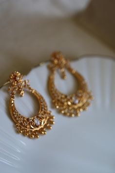 Festive earrings Ear Rings In Temple Jewelery, Luxury Handmade Jewelry For Diwali, Luxury Traditional Jhumkas For Festivals, Luxury Chandbalis With Tilla For Festivals, Luxury Dangle Chandbalis For Festivals, Luxury Gold Plated Fusion Earrings, Luxury Earrings For Diwali Celebration, Luxury Chandbalis With Intricate Design, Luxury Fusion Style Chandbalis With Intricate Design