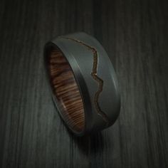 a wooden ring with an arrow etched in it