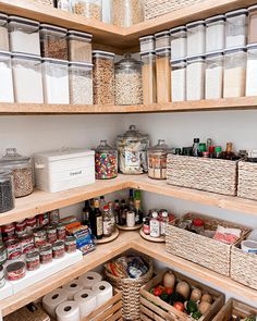 an organized pantry with lots of food in baskets and containers on the shelves, along with other items