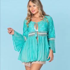 Brand New With Tags Absolutely Stunning Made Of The Highest Quality Tie Front Closure Bell Sleeves Lace Accents We Are A Licensed Retailer For Ranee’s Resort Wear Chic Turquoise Top For Beach, Casual Turquoise Beach Blouse, Chic Turquoise Beach Top, Turquoise Long Sleeve Top For Summer, Green Long Sleeve Tops For Beach Cover-up, Green Long Sleeve Beach Cover-up Top, Long Sleeve Green Top For Beach Cover-up, Bohemian Turquoise Long Sleeve Blouse, Turquoise Long Sleeve Tops For Vacation