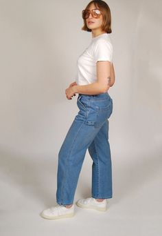 "* Size: 3 * Vintage 90s women's Union Bay carpenter jeans. * Babely denim! Medium blue wash loose fit carpenter jeans with high rise, lots of pockets, and zipper fly. * Excellent vintage condition. A 3-4\" long tear near low butt middle seam. No stains. * Material: 100% cotton. Non-stretch. - MEASUREMENTS - WAIST (doubled) 29\" waist / 31.5\" pulled taut HIPS (doubled) 38\" LENGTH 39\" INSEAM 29\" RISE 11.5\" ---- FEEL FREE TO MAKE A REASONABLE OFFER ON ANY ITEM ~ Returns accepted on all items ~ ~ Ask about discounts on multiple item orders ~" Carpenter Jeans Women Outfit, 90s Style Medium Wash Straight Leg Cargo Jeans, Denim Carpenter Pants Outfit, 90s Straight Leg Medium Wash Cargo Jeans, 90s High Rise Flare Jeans With Pockets, Carpenter Jeans For Women, Carpenter Jeans Women, Carpenter Jeans Outfit, Cotton On Carpenter Jeans