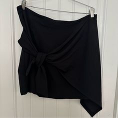 Black Super Cute Skirt With Asymmetric Style. Has Back Zipper! The Sarong Style Drapes Over To Side! Black Asymmetrical Hem Draped Skirt For Work, Black Draped Skirt With Asymmetrical Hem For Work, Chic Black Draped Skirt For Workwear, Chic Black Draped Skirt With Asymmetrical Hem, Black Asymmetrical Draped Skirt, Chic Black Asymmetrical Draped Skirt, Asymmetrical Relaxed Wrap Skirt For Night Out, Relaxed Asymmetrical Wrap Skirt For Night Out, Black Asymmetrical Draped Skirt For Night Out