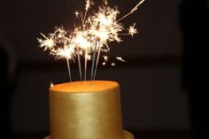 a cake with some sparklers on top of it