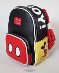 This is a Loungefly Disney Mickey Mouse "Oh Boy!" mini backpack.  Beautiful and durable pebbled black, red and yellow faux leather with white piping.  This backpack has a wonderful image of Mickey printed on the right side pocket, "OH BOY!" on the top panel and Mickey's buttons on the front pouch.  Hardware is pewter color and the bag is lined in a  solid black color. Dimensions: 10.5"H x 9”W x 4.5”D This item is new...not pre-owned.  Impeccable condition - only removed for photos.  The backpack Mickey Mouse Loungefly Backpack, Mickey Clothes, Mickey Backpack, Original Mickey Mouse, Mickey Mouse Bag, Mickey Mouse Backpack, Disney Bags Backpacks, Cute Mini Backpacks, Disney Purse