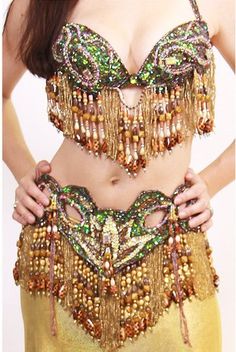 The Lili Bra and Belt set features a luxurious design adorned with cascading beading on the bust and waist for an intricate touch. Gold Lycra Skirt not included. Belly Dance Outfit, Dance Outfit, Oc Ideas, Luxurious Design, Dance Outfits, Belly Dance, Brown Gold, Beading, Lily