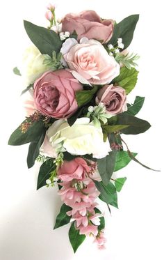 a bouquet of pink and white flowers with green leaves