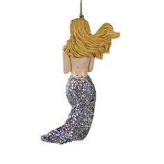 a mermaid ornament hanging from a chain