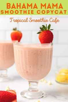 two glasses filled with smoothie and strawberries