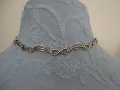 "A highly collectible vintage silver tone panel bracelet by Corocraft. It measures approx 15\" length x 0.25\" width and has a secure ring clasp. Clearly marked hang tag \"Corocraft\" in capital letters preceded by the Pegasus. It is in excellent vintage condition. Postage in the UK is by Royal Mail First Class Signed For service. Postage to all other countries is by Royal Mail Airmail Tracked and Signed For Small Packets service." Vintage Metal Choker For Formal Occasions, Formal Vintage Metal Choker, Handmade Retro Silver Choker, Handmade Silver Retro Choker, Antique Silver Metal Choker, Handmade Retro Silver Jewelry, Vintage Silver Choker For Gift, Vintage Silver Choker As Gift, Retro Metal Jewelry For Anniversary