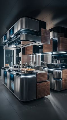 a modern kitchen with stainless steel appliances and wood cabinetry in the center, along with an island