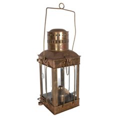 an old fashioned brass lantern on a white background