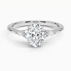 an oval cut diamond engagement ring with side stones