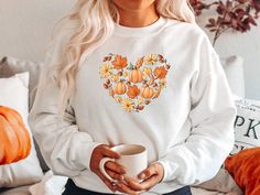 "Fall Heart Doodles 🎃🧡 Celebrate your love of Fall and Pumpkins with one of our trendy tees or sweatshirts! You'll love this cute pumpkin shirt so much, that you'll want to wear it all year! Shop MORE FALL Shirts/Sweatshirts here: https://etsy.me/2XrN5hB * * * * * * * * * * * * * * * * * * * * * * * * * * * * * ♥️ LISTING 1 - Fall Heart Doodles Shirt or Sweatshirt HOW TO ORDER: * Choose size. (Unisex T-Shirt or Crewneck Sweatshirt) * Select Color if available. * Enter personalization if needed Doodle Shirt, Heart Sweatshirt, Heart Sweater, Pumpkin Shirt, Heart Shirt, Valentines Day Hearts, Fall Sweatshirt, Valentine Day Love, Love Shirt