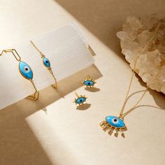 A stunning range of jewelry with a distinctive exotic look incorporating designs which include the Divine Eye and Hand of Fatima/Hamsa. Metal: 925 Sterling Silver Plating: 14K Yellow Gold Stones: Synthetic Opal 4X8 MM Traditional 14k Gold Drop Earrings, Traditional 14k Gold Pierced Jewelry, Symbolic Yellow Gold Jewelry For Pierced Ears, Symbolic 14k Gold Pierced Jewelry, Sterling Silver Teardrop Evil Eye Jewelry, Sterling Silver Evil Eye Teardrop Jewelry, Spiritual Gold Plated Dangle Jewelry, Symbolic Drop Earrings Jewelry As Gift, Symbolic Drop Earrings Jewelry Gift