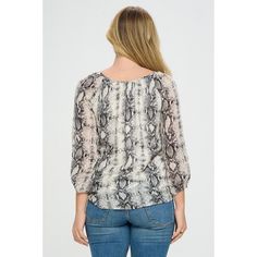 This three-quarter sleeve printed blouse is also one our favorite go-to items! It has a keyhole detail and a tie front knot at the waist. We love this look when paired back to denim as a perfect everyday top. It is lined for coverage. Imported. Material - 100% Polyester. Lining - 100% Polyester Machine washable. Printed 3/4 Sleeve Blouse, Printed 3/4 Sleeve Blouse For Fall, Snakeskin Top Outfit, Snakeskin Blouse Outfit, Stretch V-neck Printed Blouse, Rayon V-neck Top With Button Closure, Patterned Ikat Print Long Sleeve Tops, Tie Front Blouse, Shipt Shopper