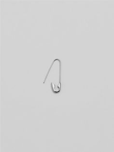 a pair of silver ear hooks on a white background with the word love written in cursive writing