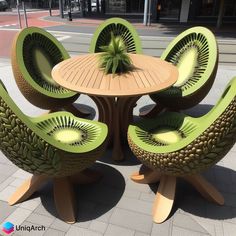 an outdoor table with four chairs and a potted plant sitting on top of it