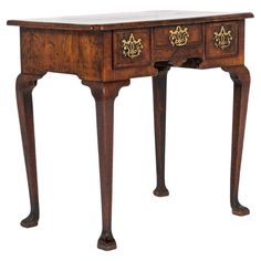 an antique wooden desk with two drawers