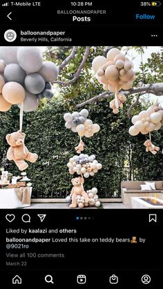 an instagram with balloons and teddy bears hanging from the ceiling in front of trees