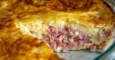 a close up of a casserole dish with meat and cheese on it's crust