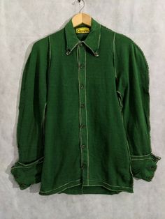 NEMETH iconic green stretchy renaissance shirt with rounded seams and big cuffs. Pit to pit: 19" Length: 31" Shoulders: 12" Shoulder to cuff: 30" Classic Long Sleeve Pre-washed Shirt, Pre-washed Long Sleeve Cotton Shirt, Pre-washed Cotton Long Sleeve Shirt, Vintage Fitted Pre-washed Tops, Fitted Vintage Pre-washed Tops, Classic Long Sleeve Pre-washed Tops, Fitted Cotton Shirt Pre-washed, Pre-washed Cotton Long Sleeve Tops, 1940s Mens Clothing