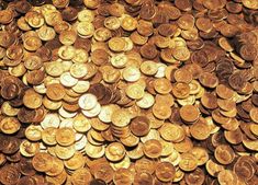 a pile of gold coins sitting on top of each other