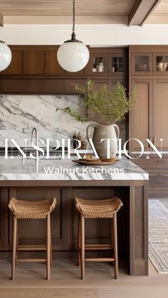 a kitchen with marble counter tops and stools next to an island in the middle