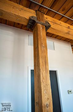 a wooden cross is hanging from the ceiling