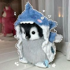 a stuffed animal with a blue hat on it's head