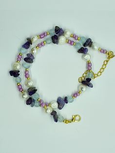 "Mixed Gemstones Necklace. Freshwater Pearl's. Amethyst. Aquamarine  and glass seed beads. All in tones of purples and Aqua blues.  16inch with extendable chain  The properties of aquamarine related to physical healing are thought to be closely connected with breathing. Sometimes referred to as the \"breath stone,\" aquamarine is known to alleviate sinus, lung, and respiratory problems. It is also believed to help with bronchitis, colds, hay fever, and various allergies. Amethyst is a natural tr Respiratory Problems, Hay Fever, Physical Healing, Necklace Amethyst, Necklace Purple, Gemstone Beaded Necklace, Necklace Gemstone, Aquamarine Gemstone, Glass Seed Beads