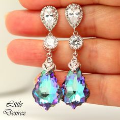 "These gorgeous and timeless Swarovski Vitrail Light Earrings have a Victorian touch of elegance and romance. The baroque pendants have classic scroll-shaped silhouettes and are precision beveled/faceted to enhance the color and characteristic of the crystal, making each piece a glistening treasure! Perfect for brides, bridesmaids and special occasions! Earrings made with: - 22mm GENUINE Swarovski Vitrail Light Baroque crystals. The crystals emit so much shine and sparkle as it changes colors at Elegant Lavender Crystal Earrings For Party, Lavender Drop Earrings For Formal Occasions, Elegant Lavender Earrings For Party, Lavender Dangle Earrings For Formal Occasion, Purple Dangle Bridal Earrings, Elegant Purple Clip-on Earrings, Elegant Lavender Crystal Dangle Earrings, Elegant Lavender Crystal Earrings For Wedding, Purple Dangle Bridal Earrings For Formal Occasions