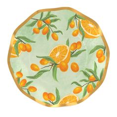 an orange pattern on a plate with green leaves and oranges painted on it's surface