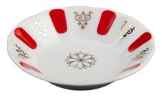 a white and red bowl with designs on the bottom, sitting in front of a white background